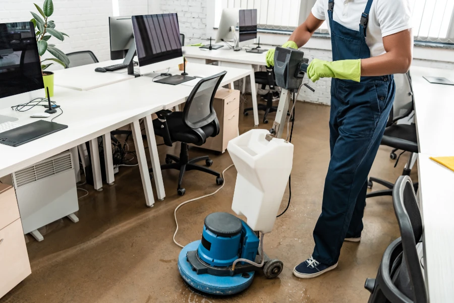 Partial view of worker washing floor